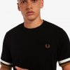 Camisetas de piqué con puños a rayas