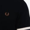 Camisetas de piqué con puños a rayas