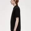 Polo texturizado con cuello y cremallera para hombre