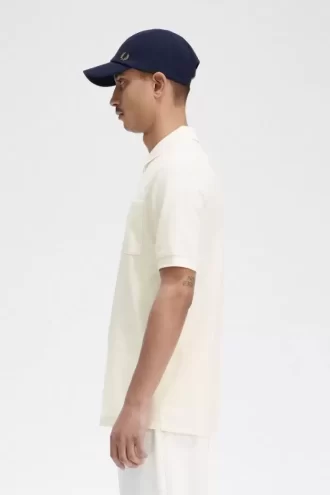 Polo texturizado con cuello y cremallera para hombre