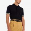 Polos con puños a rayas Polos con puños a rayas