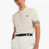 Polos con puños a rayas Polos con puños a rayas