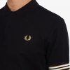 Polos con puños a rayas Polos con puños a rayas