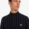 Polos de cuello alto con rayas finas
