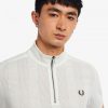 Polos de manga raglán con cuello y cremallera Polos de manga raglán con cuello y cremallera