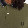 Polos de rayas con medallas Polos de rayas con medallas